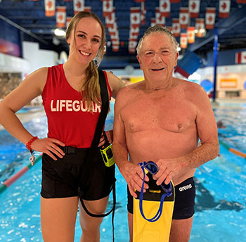 Lifeguard Erika Burroughs with 75 yr old senior swimmer Brian Noble a regular at Grand Forks Aquatic Centre